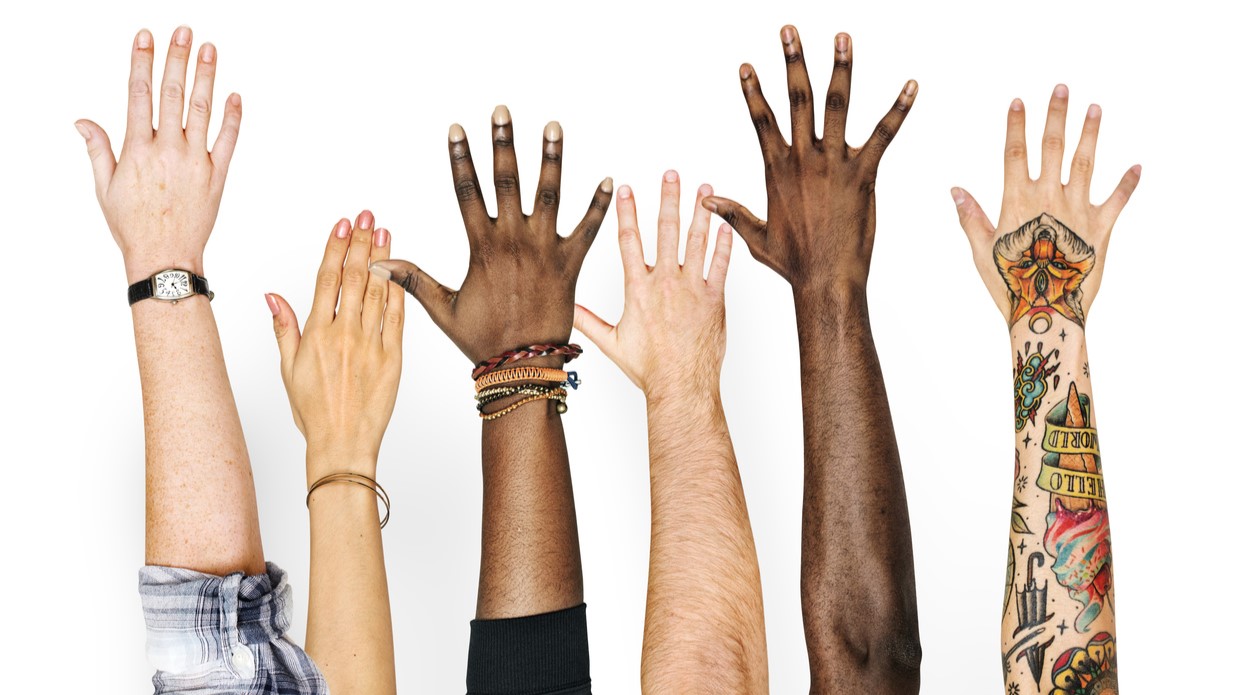 out stretched arms of six different people