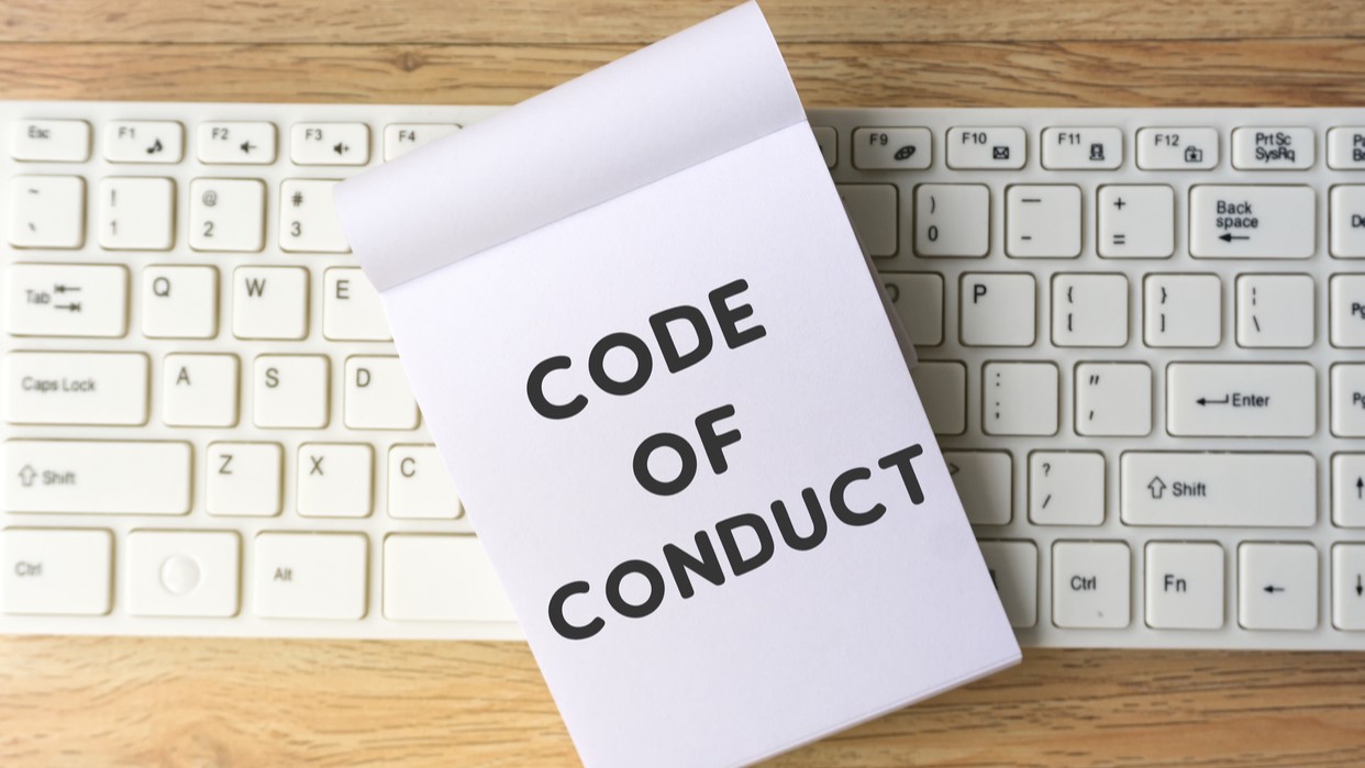 Code of conduct written on a notepad