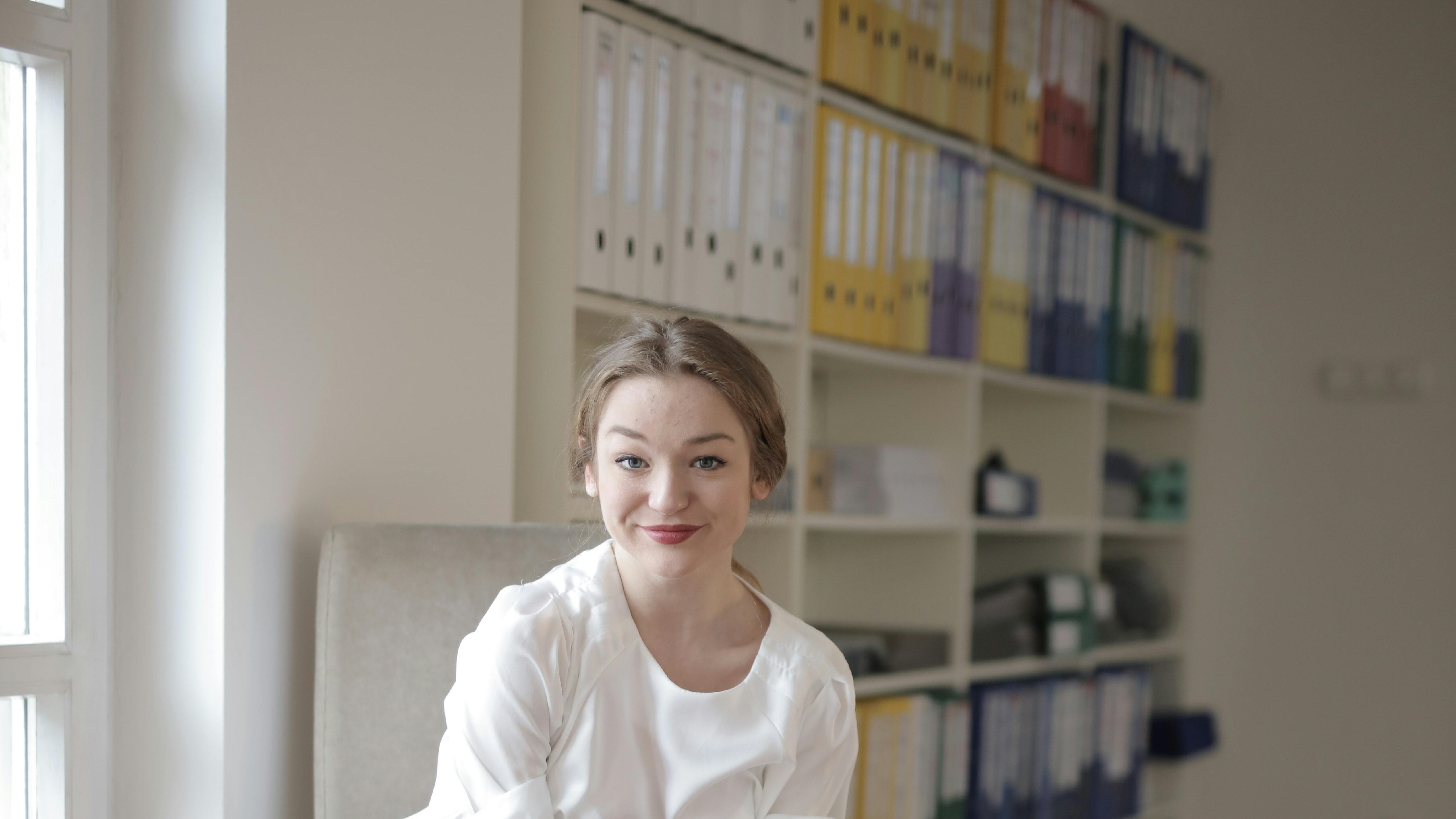 Person sitting in front of filing case